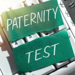 Paternity test search concept showing green sticky notes with "PATERNITY TEST" text on computer keyboard representing online DNA testing services in Nashville Tennessee